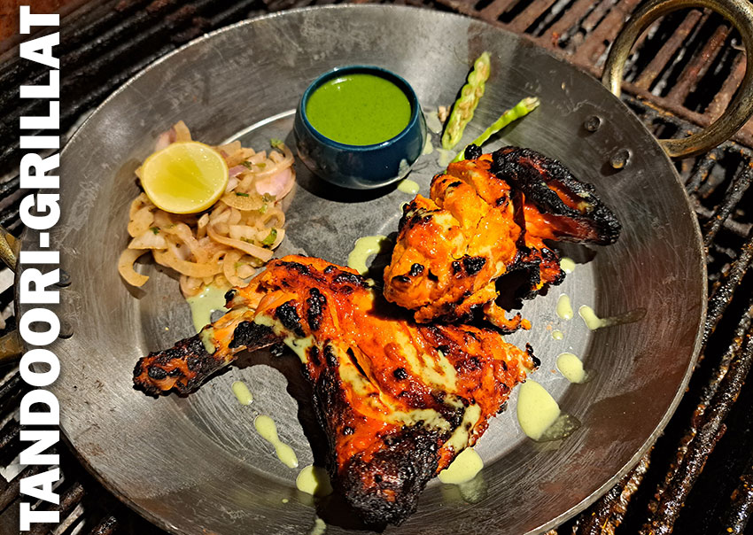 Tandoori-kyckling grillad i traditionell lerugn